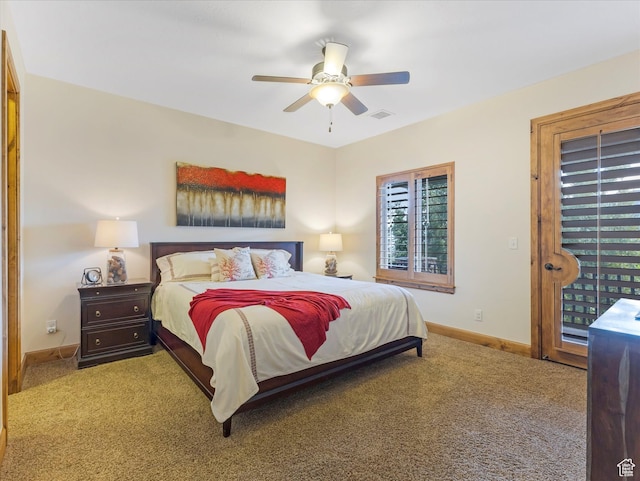 carpeted bedroom featuring baseboards, a ceiling fan, and access to exterior