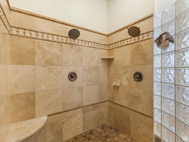 full bath featuring tiled shower
