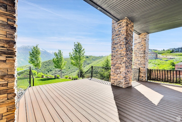 wooden deck featuring a mountain view