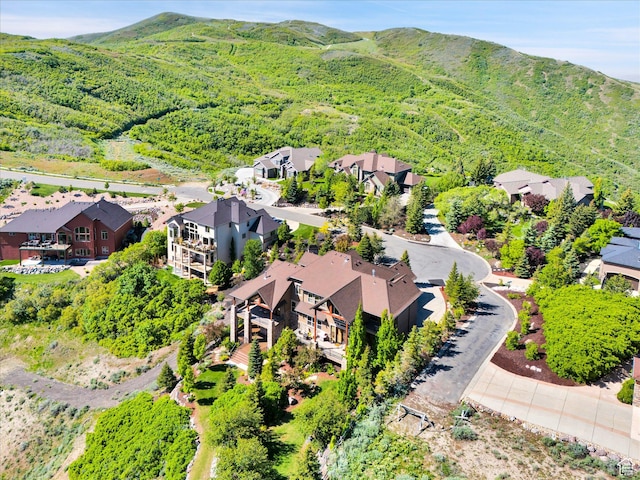 aerial view of residential area featuring mountains