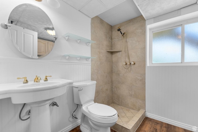 1188 E 300 N, Layton, UT 84040 - bathroom with tiled shower, wood finished floors, toilet, and healthy amount of natural light