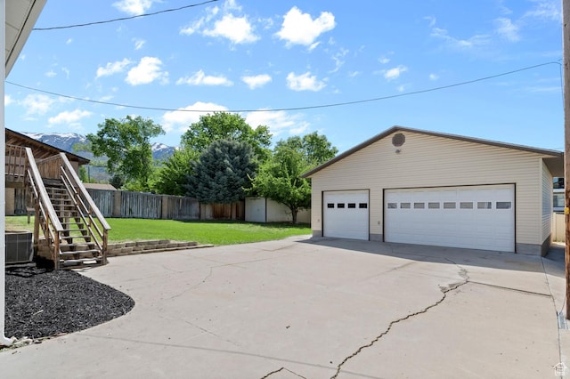 1188 E 300 N, Layton, UT 84040 - view of property exterior featuring an outbuilding, stairway, central AC, and a detached garage