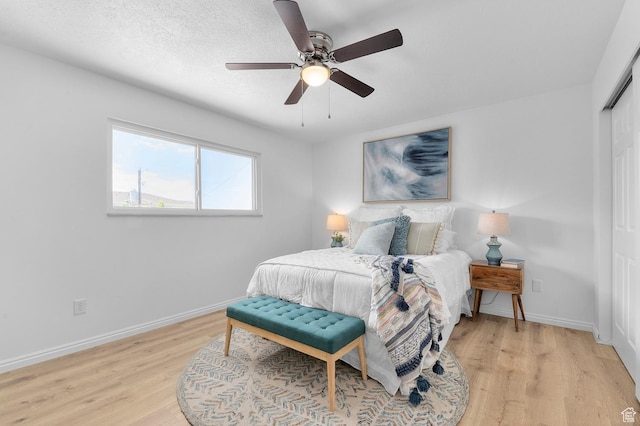 1188 E 300 N, Layton, UT 84040 - bedroom featuring light wood-style flooring, baseboards, ceiling fan, and a closet