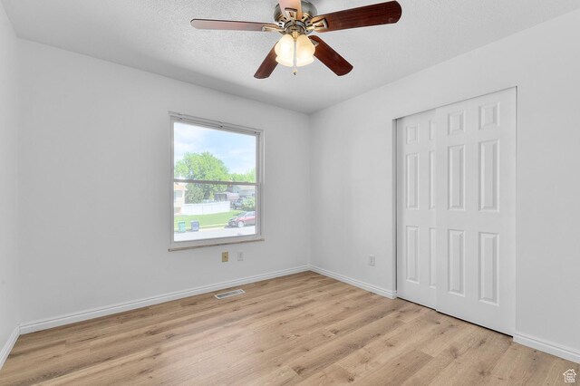 1188 E 300 N, Layton, UT 84040 - empty room featuring a ceiling fan, light wood-type flooring, baseboards, and a textured ceiling