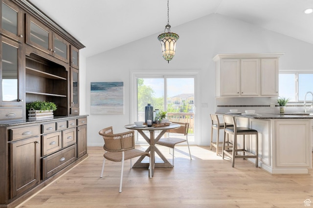 1188 E 300 N, Layton, UT 84040 - dining area featuring healthy amount of natural light, light wood finished floors, and high vaulted ceiling