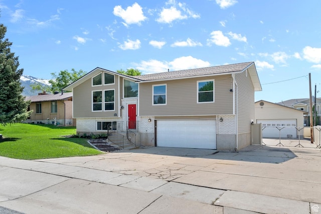 1188 E 300 N, Layton, UT 84040 - raised ranch featuring an attached garage, brick siding, concrete driveway, and a front yard