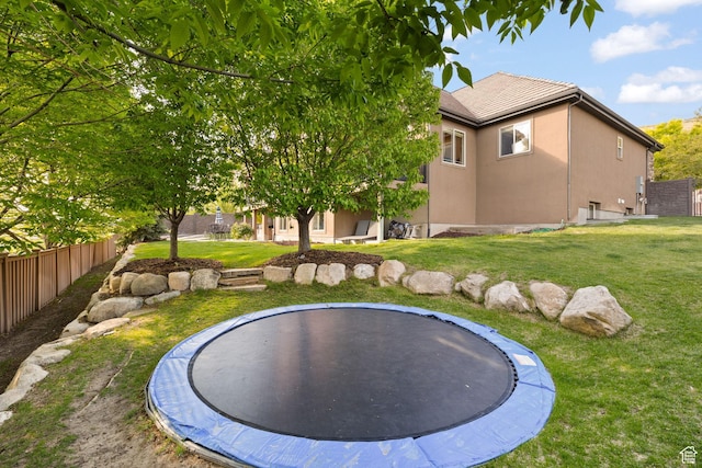 view of yard with a trampoline