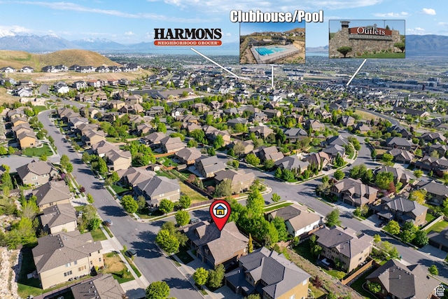 aerial view of residential area featuring a mountainous background