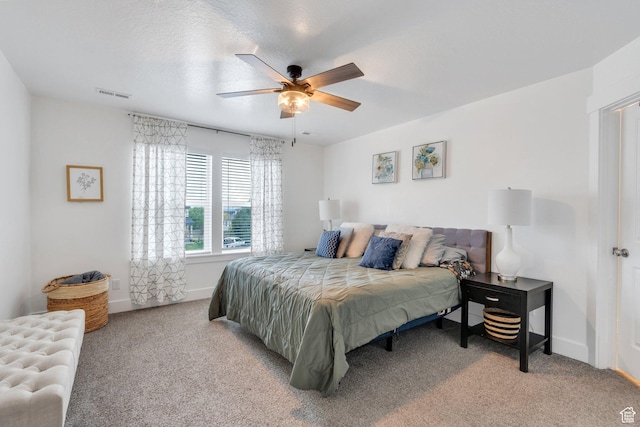 bedroom featuring carpet floors, baseboards, and a ceiling fan