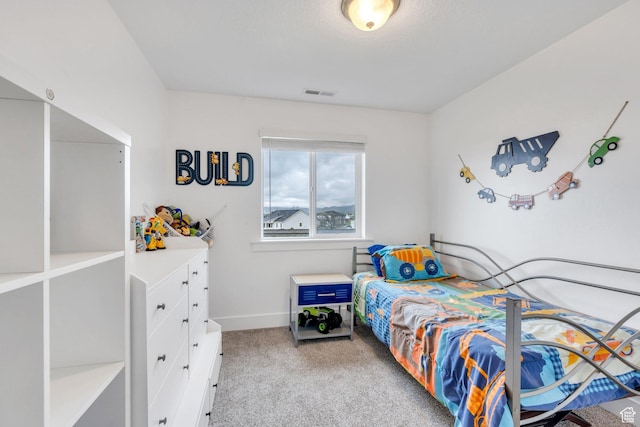 carpeted bedroom with baseboards