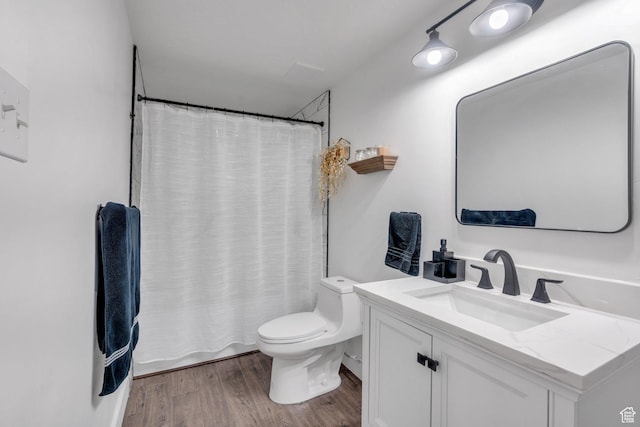full bathroom with toilet, vanity, wood finished floors, and a shower with shower curtain
