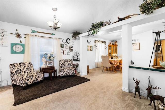 sitting room featuring carpet flooring, a chandelier, and baseboards