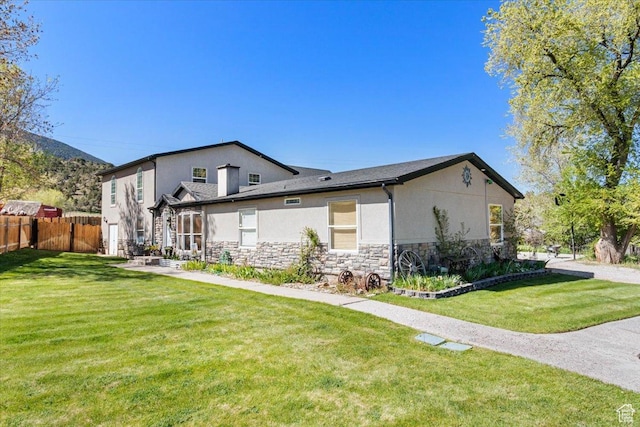 view of property exterior with stone siding and stucco siding