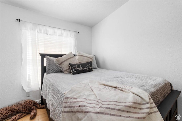bedroom with wood finished floors