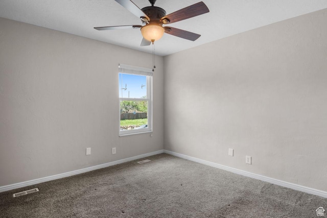 unfurnished room with carpet flooring, baseboards, and ceiling fan