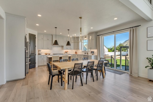 dining area featuring recessed lighting and light wood finished floors
