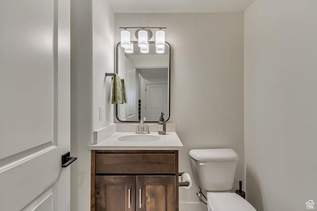 bathroom with toilet and vanity