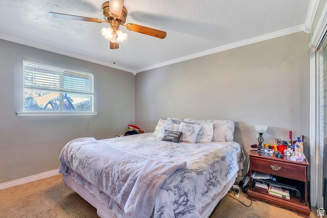bedroom with carpet, crown molding, baseboards, ceiling fan, and a textured ceiling