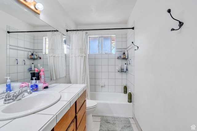 bathroom with vanity, shower / bath combination with curtain, tile patterned floors, and toilet