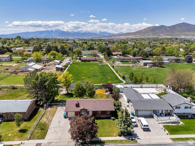 aerial view of residential area featuring mountains