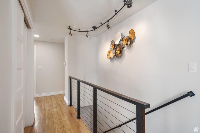 3501 E Loren Von Dr, Millcreek, UT 84124 - hallway featuring an upstairs landing, light wood finished floors, and baseboards