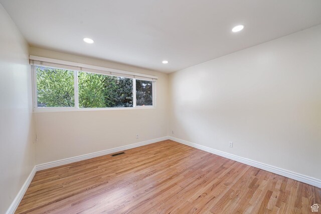 3501 E Loren Von Dr, Millcreek, UT 84124 - empty room featuring healthy amount of natural light, baseboards, light wood finished floors, and recessed lighting