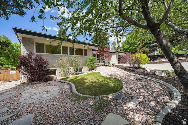 view of front of house featuring brick siding