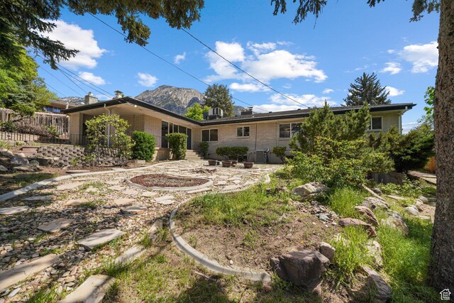 3501 E Loren Von Dr, Millcreek, UT 84124 - rear view of house with a mountain view and brick siding