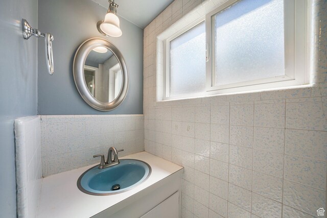 3501 E Loren Von Dr, Millcreek, UT 84124 - bathroom featuring tile walls and vanity