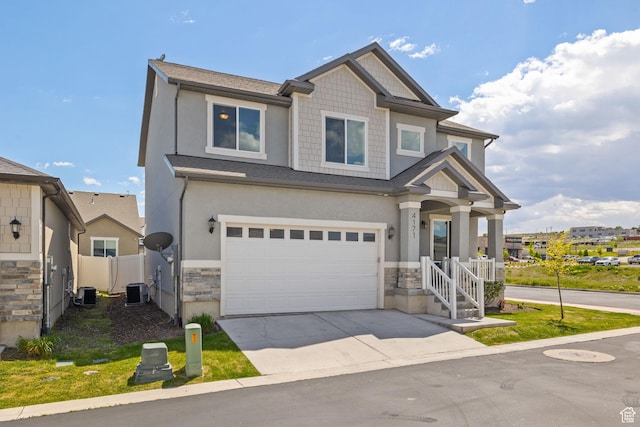 craftsman-style home with stone siding, an attached garage, fence, concrete driveway, and cooling unit
