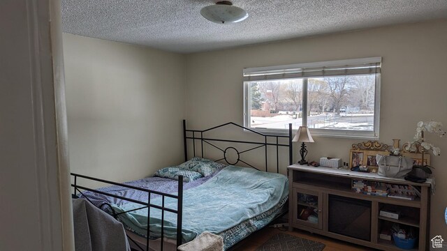 1341 E Creek Rd, Cottonwood Heights, UT 84093 - bedroom with a textured ceiling and wood finished floors