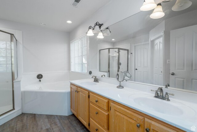 1200 N Warm Springs Rd, Midway, UT 84049 - bathroom with a stall shower, double vanity, a bath, wood finished floors, and recessed lighting