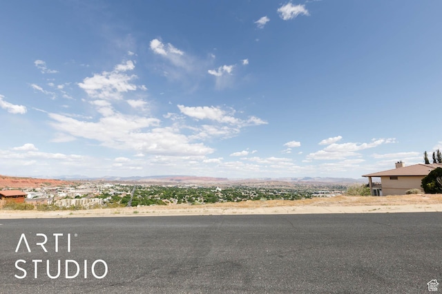 view of asphalt street featuring a mountain view