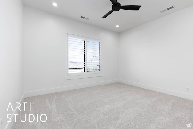 carpeted spare room featuring a ceiling fan, recessed lighting, and baseboards