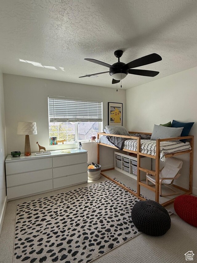 4901 N Eagle Nest Ln, Lehi, UT 84043 - bedroom with baseboards, a textured ceiling, and a ceiling fan