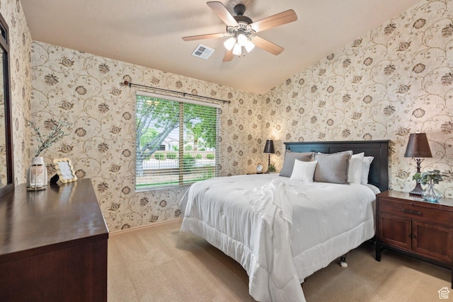 bedroom with light carpet, wallpapered walls, ceiling fan, and baseboards