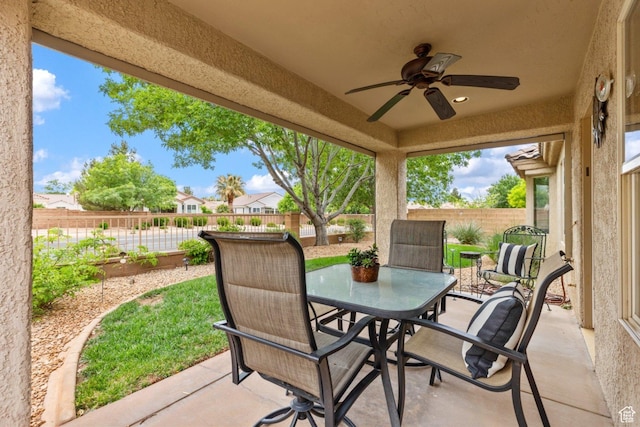 view of patio / terrace with a ceiling fan, a fenced backyard, and outdoor dining area