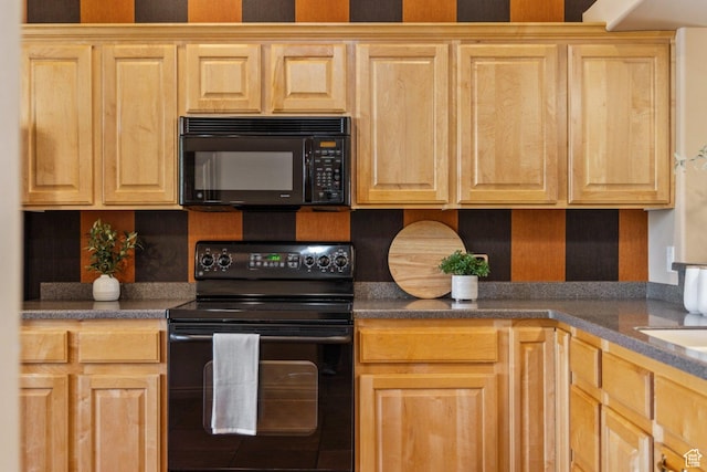 kitchen with black appliances, light brown cabinetry, and tasteful backsplash