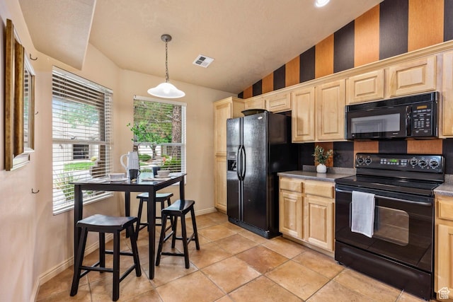 kitchen with black appliances, light brown cabinetry, plenty of natural light, lofted ceiling, and baseboards
