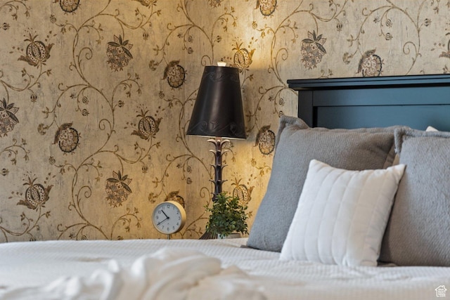 unfurnished bedroom featuring wallpapered walls