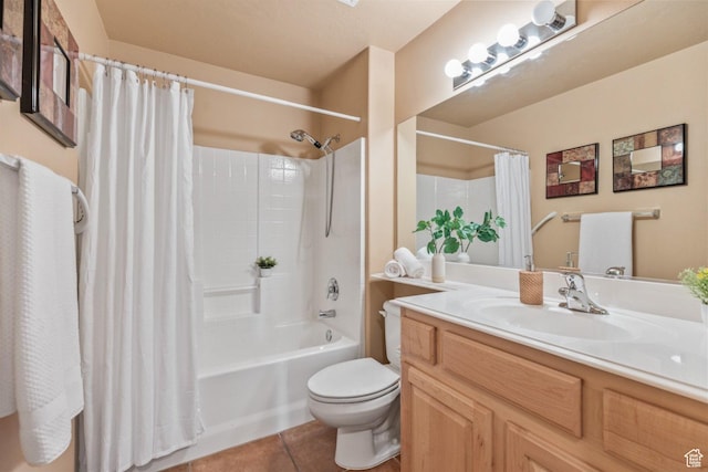 bathroom with tile patterned flooring, toilet, vanity, and shower / bath combo