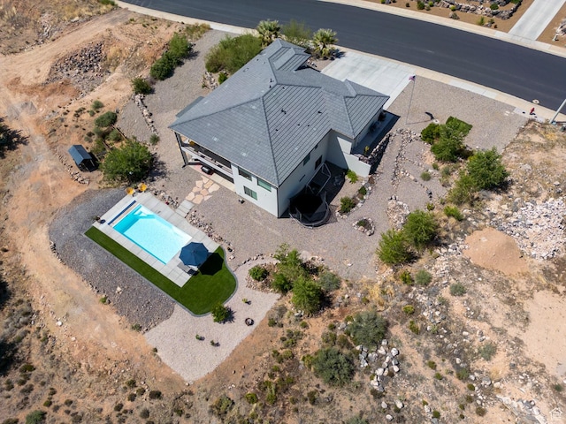 view of subject property with a pool area