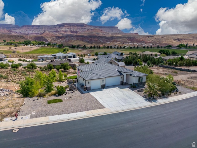 view of subject property featuring a mountain backdrop