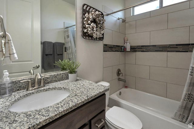 full bath with shower / tub combo with curtain, toilet, and vanity