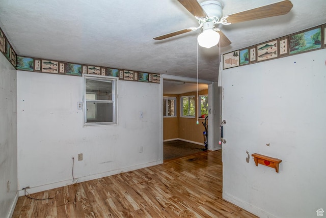 345 N Main St, Ivins, UT 84738 - spare room featuring wood finished floors, baseboards, and a ceiling fan