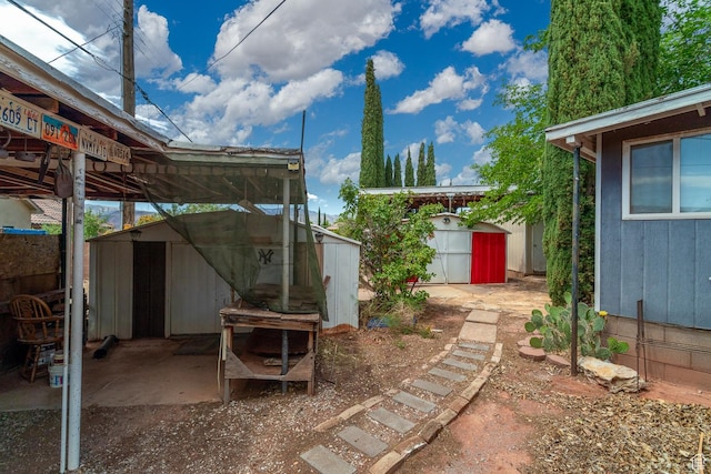 345 N Main St, Ivins, UT 84738 - view of yard featuring a storage shed and an outdoor structure