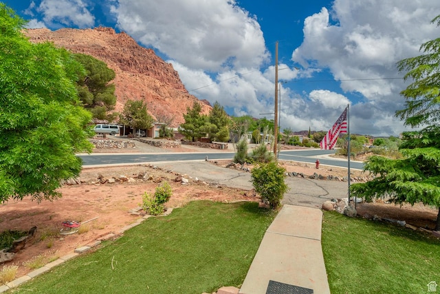 345 N Main St, Ivins, UT 84738 - view of community featuring a lawn and a mountain view