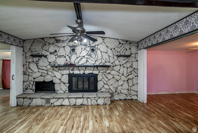 345 N Main St, Ivins, UT 84738 - unfurnished living room featuring ceiling fan, a stone fireplace, wood finished floors, baseboards, and vaulted ceiling