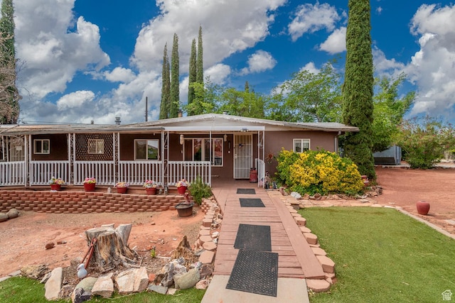 345 N Main St, Ivins, UT 84738 - view of front facade with covered porch and stucco siding