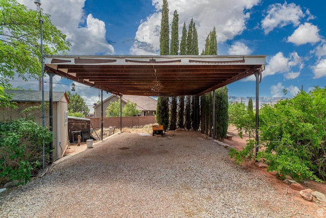 345 N Main St, Ivins, UT 84738 - view of vehicle parking with a carport and gravel driveway